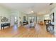 Spacious living room featuring hardwood floors, zebra statue, and view to backyard patio at 7102 42Nd E Ct, Sarasota, FL 34243