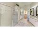Bright bathroom featuring an open floor plan, with lots of vanity space, and a large shower at 7102 42Nd E Ct, Sarasota, FL 34243