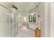 Bright bathroom featuring an open floor plan, with lots of vanity space, and a large shower at 7102 42Nd E Ct, Sarasota, FL 34243