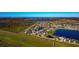 Gorgeous aerial view of a neighborhood with picturesque lakes and lush landscaping at 718 Tanana Fall Dr, Ruskin, FL 33570