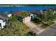 Single-story home with a well-kept lawn, mature trees, and close to a picturesque lake at 718 Tanana Fall Dr, Ruskin, FL 33570