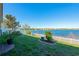 Scenic backyard with white picket fence and views of the lake at 718 Tanana Fall Dr, Ruskin, FL 33570