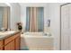 Bathroom with a bathtub and vanity at 718 Tanana Fall Dr, Ruskin, FL 33570