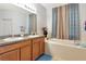 Bathroom featuring dual sinks and a bathtub at 718 Tanana Fall Dr, Ruskin, FL 33570