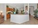 Open kitchen featuring wood cabinets, modern appliances, and breakfast bar area at 718 Tanana Fall Dr, Ruskin, FL 33570