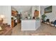 Open kitchen featuring wood cabinets, modern appliances, and breakfast bar with chairs at 718 Tanana Fall Dr, Ruskin, FL 33570