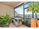 Enclosed outdoor kitchen with stunning lake views and stainless steel sink at 718 Tanana Fall Dr, Ruskin, FL 33570