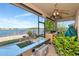 Enclosed outdoor kitchen with lake views and stainless steel sink at 718 Tanana Fall Dr, Ruskin, FL 33570