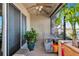 Enclosed patio with stainless sink, views of the lake and ceiling fan at 718 Tanana Fall Dr, Ruskin, FL 33570