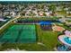 Great aerial shot of playground, tennis and basketball courts in neighborhood at 718 Tanana Fall Dr, Ruskin, FL 33570