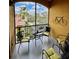 Comfortable balcony with seating and decorative bike hanging on the wall, perfect for relaxing with a view at 8397 38Th Street E Cir # 306, Sarasota, FL 34243