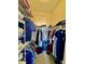 Organized walk-in closet with ample storage and hanging space, perfect for keeping clothes tidy at 8397 38Th Street E Cir # 306, Sarasota, FL 34243