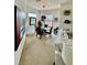 Bright dining area featuring modern decor, a stylish round table, and ample natural light at 8397 38Th Street E Cir # 306, Sarasota, FL 34243