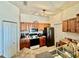Efficient kitchen layout with stainless appliances, tile flooring, and lots of cabinet space for organized storage at 8397 38Th Street E Cir # 306, Sarasota, FL 34243