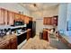 Well-equipped kitchen with stainless steel appliances, ample cabinet space, and track lighting at 8397 38Th Street E Cir # 306, Sarasota, FL 34243