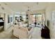 Bright living room featuring a neutral color palette, comfortable seating and a sliding glass door to the balcony at 8397 38Th Street E Cir # 306, Sarasota, FL 34243
