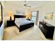 Serene main bedroom features a well-made bed, a ceiling fan, and bedside tables with lamps at 8397 38Th Street E Cir # 306, Sarasota, FL 34243