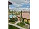 Beautiful pool view of a community with lush landscaping, palm trees, and well-maintained buildings at 8397 38Th Street E Cir # 306, Sarasota, FL 34243