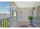 Comfortable balcony space with seating, perfect for enjoying the outdoors and overlooking peaceful surroundings, unit 2722 at 9499 Millbank Dr # 2722, Sarasota, FL 34238