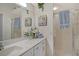 Clean bathroom with white marble countertops and modern fixtures at 9499 Millbank Dr # 2722, Sarasota, FL 34238