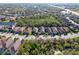 An aerial view of the community showing well-manicured lawns and lush landscaping in a tranquil setting at 9902 Craftsman Park Way, Palmetto, FL 34221