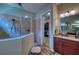 Elegant bathroom featuring a tiled walk-in shower and an entrance to the closet at 9902 Craftsman Park Way, Palmetto, FL 34221