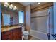 Well-maintained bathroom with granite vanity top and tiled shower at 9902 Craftsman Park Way, Palmetto, FL 34221