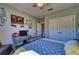Bright bedroom with a full bed, modern decor, and a window with outdoor views at 9902 Craftsman Park Way, Palmetto, FL 34221