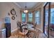 Bright breakfast nook featuring a glass table set and large windows at 9902 Craftsman Park Way, Palmetto, FL 34221