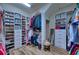 Spacious walk-in closet with custom shelving and storage solutions at 9902 Craftsman Park Way, Palmetto, FL 34221