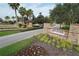 Esplanade at Artisan Lakes entrance with lush landscaping, flowers and brick and stone accents at 9902 Craftsman Park Way, Palmetto, FL 34221