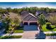 Beautiful tile roof on a well maintained house with a two car garage and manicured landscaping at 9902 Craftsman Park Way, Palmetto, FL 34221