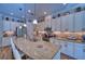 Bright, open kitchen with granite countertops, stainless steel appliances, and breakfast bar seating at 9902 Craftsman Park Way, Palmetto, FL 34221