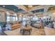 Spacious lounge area with plush sofas, decorative area rugs and large windows for natural light at 9902 Craftsman Park Way, Palmetto, FL 34221