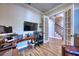 Office with wood floors, large desk, and an open doorway to stairs at 9902 Craftsman Park Way, Palmetto, FL 34221