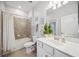 Comfortable bathroom features a shower-tub combo, modern fixtures, and neutral paint at 10008 Carnoustie Pl, Bradenton, FL 34211