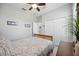Comfortable bedroom showcases a wooden bed frame and natural light from the window at 10008 Carnoustie Pl, Bradenton, FL 34211