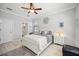 Comfortable bedroom features crown molding, ceiling fan, and ensuite bathroom at 10008 Carnoustie Pl, Bradenton, FL 34211