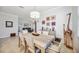 Elegant dining room featuring neutral walls, stylish decor, and an open layout leading to the living area at 10008 Carnoustie Pl, Bradenton, FL 34211