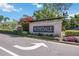 Community entrance features a sign for Rosedale and surrounding landscaping at 10008 Carnoustie Pl, Bradenton, FL 34211
