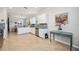 Well-lit kitchen featuring white cabinetry, granite countertops, stainless steel appliances, and an open layout at 10008 Carnoustie Pl, Bradenton, FL 34211