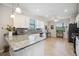 Modern kitchen featuring granite countertops, white cabinets, stainless steel appliances and lots of counter space at 10008 Carnoustie Pl, Bradenton, FL 34211