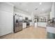 Spacious kitchen features stainless appliances, granite counters, tile backsplash, and tile flooring at 10008 Carnoustie Pl, Bradenton, FL 34211
