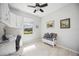 Bright office featuring built-in cabinets and a large window offering a view of the backyard at 10008 Carnoustie Pl, Bradenton, FL 34211