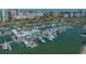 Stunning aerial view of the marina showcasing numerous yachts and the city skyline at 101 S Gulfstream Ave # 16K, Sarasota, FL 34236