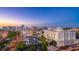 Gorgeous aerial view of an upscale coastal city featuring an architectural skyline, beautiful buildings, and lush trees at 101 S Gulfstream Ave # 16K, Sarasota, FL 34236