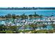 Picturesque aerial view featuring luxury yachts, marina, and coastal scenery, showcasing a sought-after destination for boaters at 101 S Gulfstream Ave # 16K, Sarasota, FL 34236