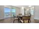 Bright dining area featuring wood floors and water view access at 101 S Gulfstream Ave # 16K, Sarasota, FL 34236