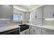 Beautiful kitchen with gray cabinets, quartz countertops, undermount sink, and stylish backsplash at 101 S Gulfstream Ave # 16K, Sarasota, FL 34236
