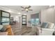 Spacious living room featuring tile floors, modern decor, and access to the balcony at 101 S Gulfstream Ave # 16K, Sarasota, FL 34236